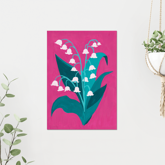 Lily of the Valley birth month flower art print for May, featuring delicate white blooms against a bold pink background with lush greenery. Symbolizing humility and renewal, this botanical print adds elegance and charm to any space.